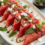 Delicious sous vide compressed watermelon slices with feta and mint.