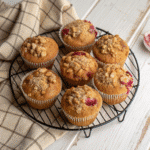Delicious homemade rhubarb and strawberry muffins with fresh fruits.